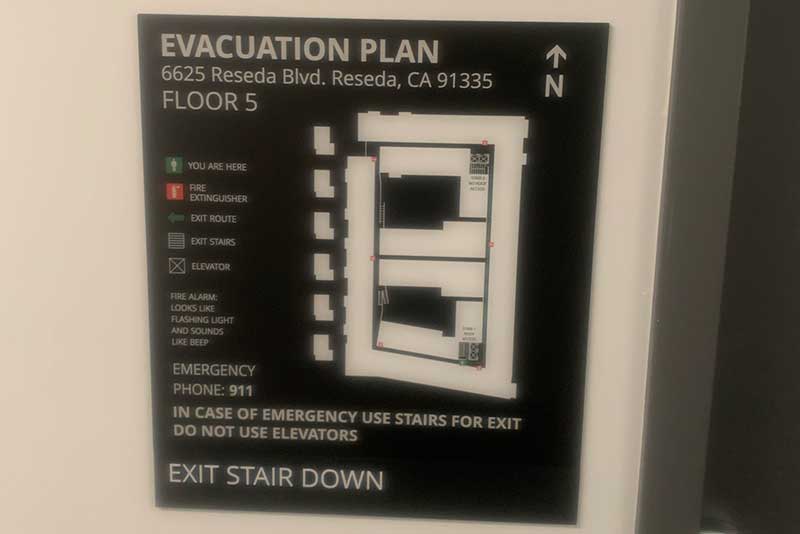 ADA-compliant evacuation sign