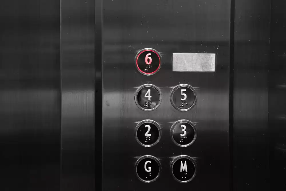 An elevator with braille buttons